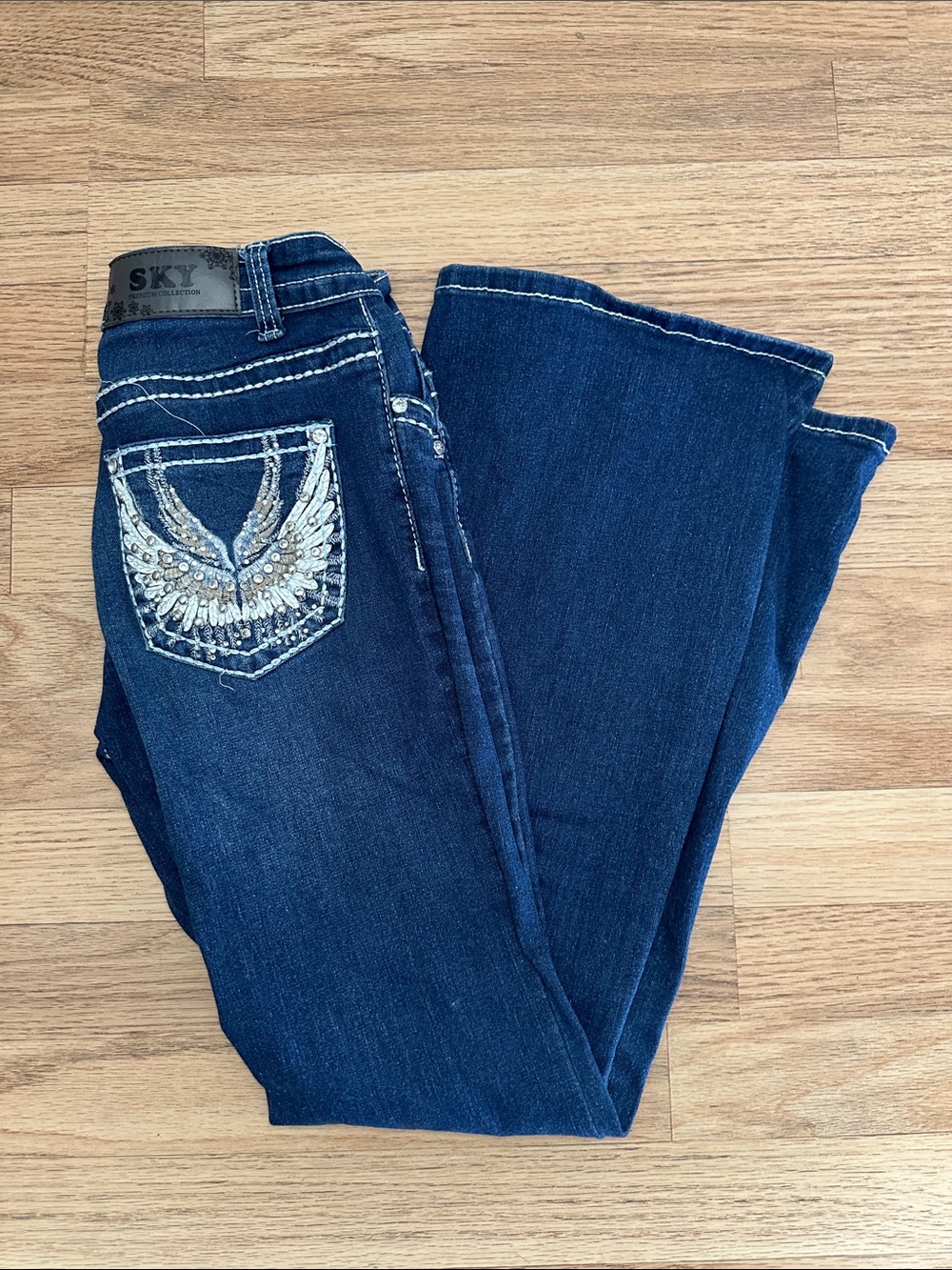 Sky Dark Blue Bootcut Jeans with Embellished Wing Pocket